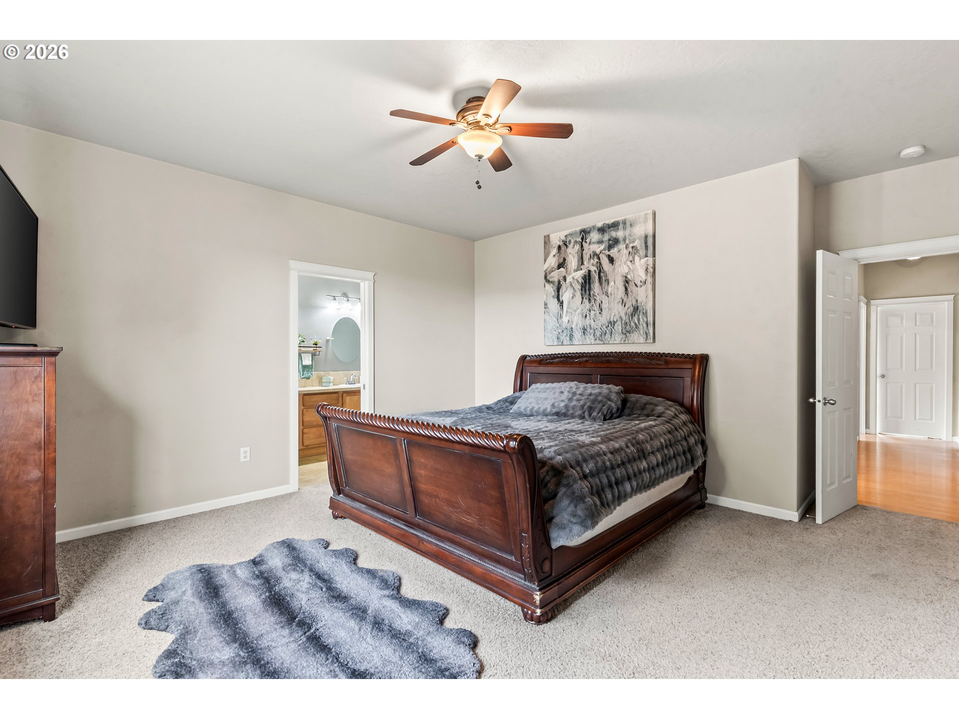 77286 Joyce Way Echo, OR 97826 - Photo 18 of 41 a bedroom with a large bed and a ceiling fan