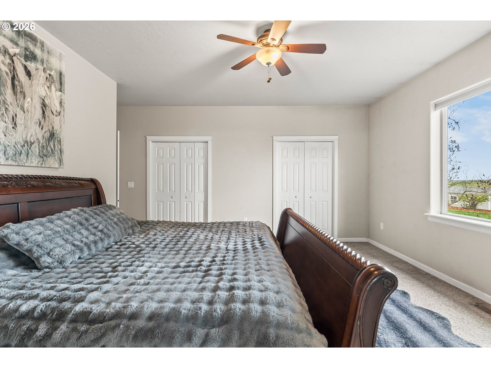 77286 Joyce Way Echo, OR 97826 - Photo 20 of 41 a bedroom with a bed and a chandelier