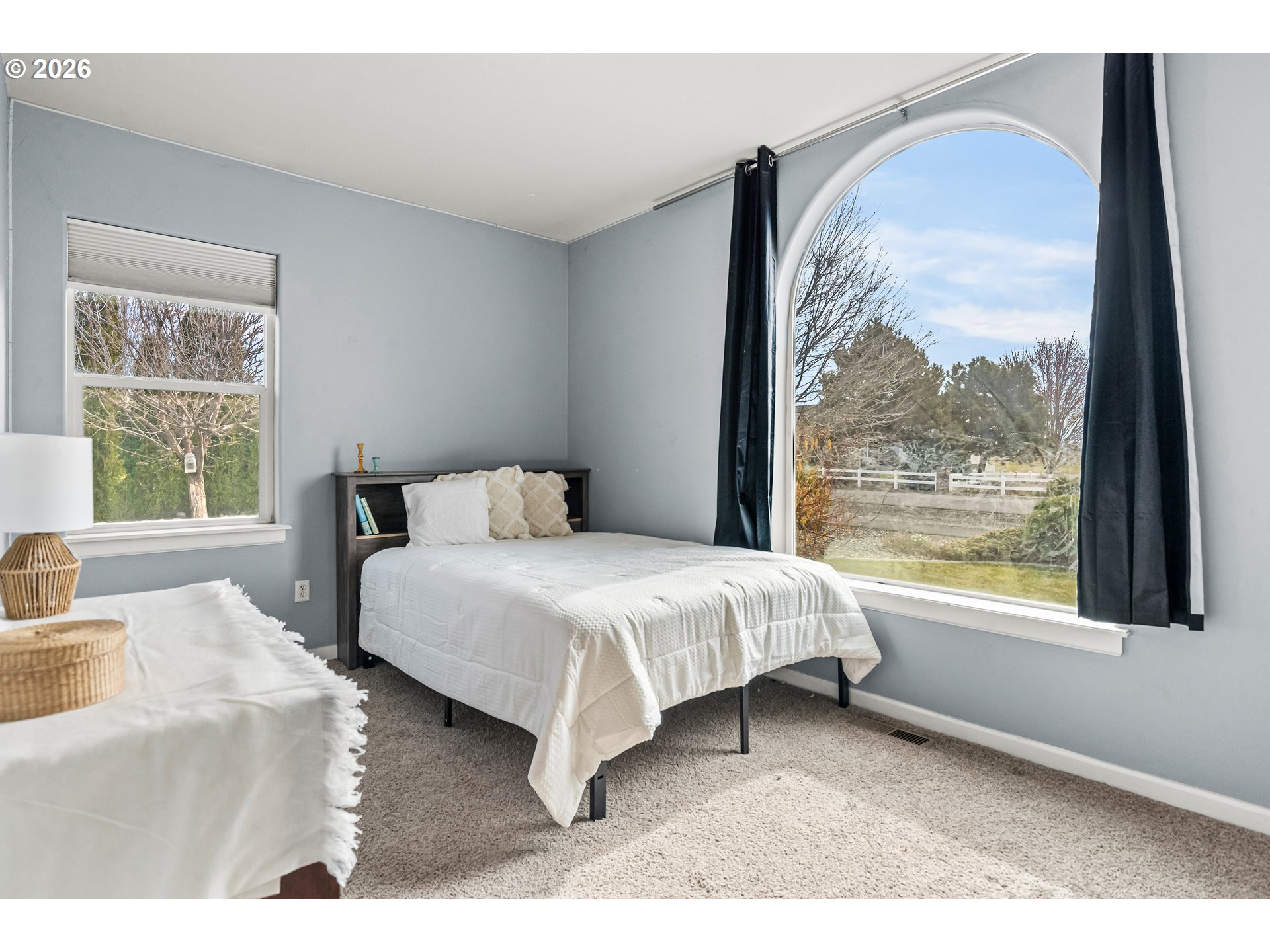 77286 Joyce Way Echo, OR 97826 - Photo 23 of 41 a bedroom with a large bed and a large window