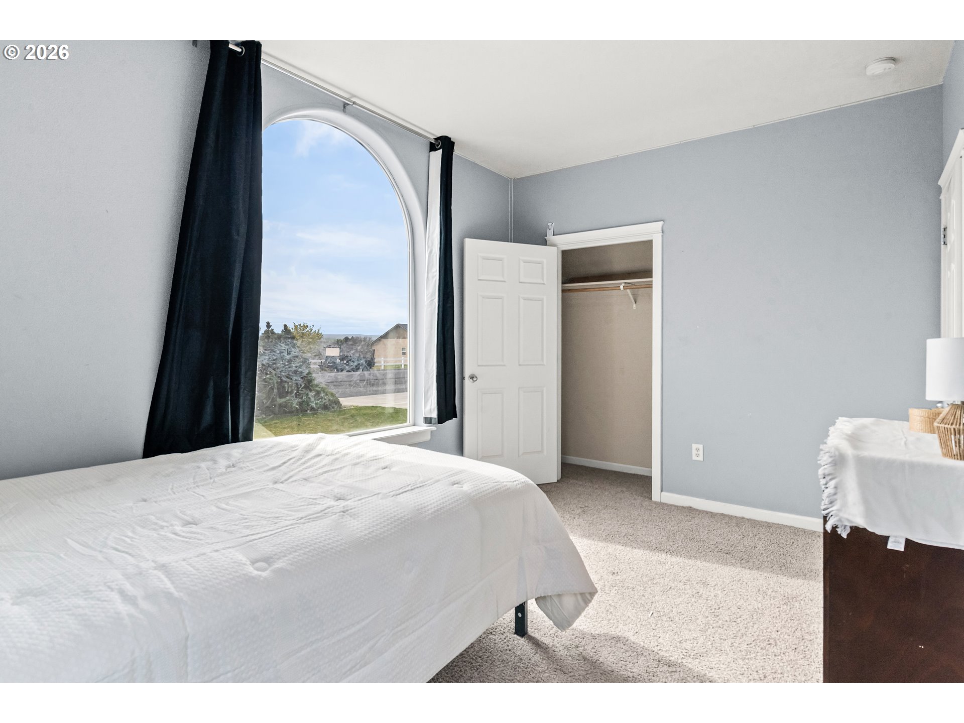 77286 Joyce Way Echo, OR 97826 - Photo 24 of 41 a bedroom with a bed and a large window