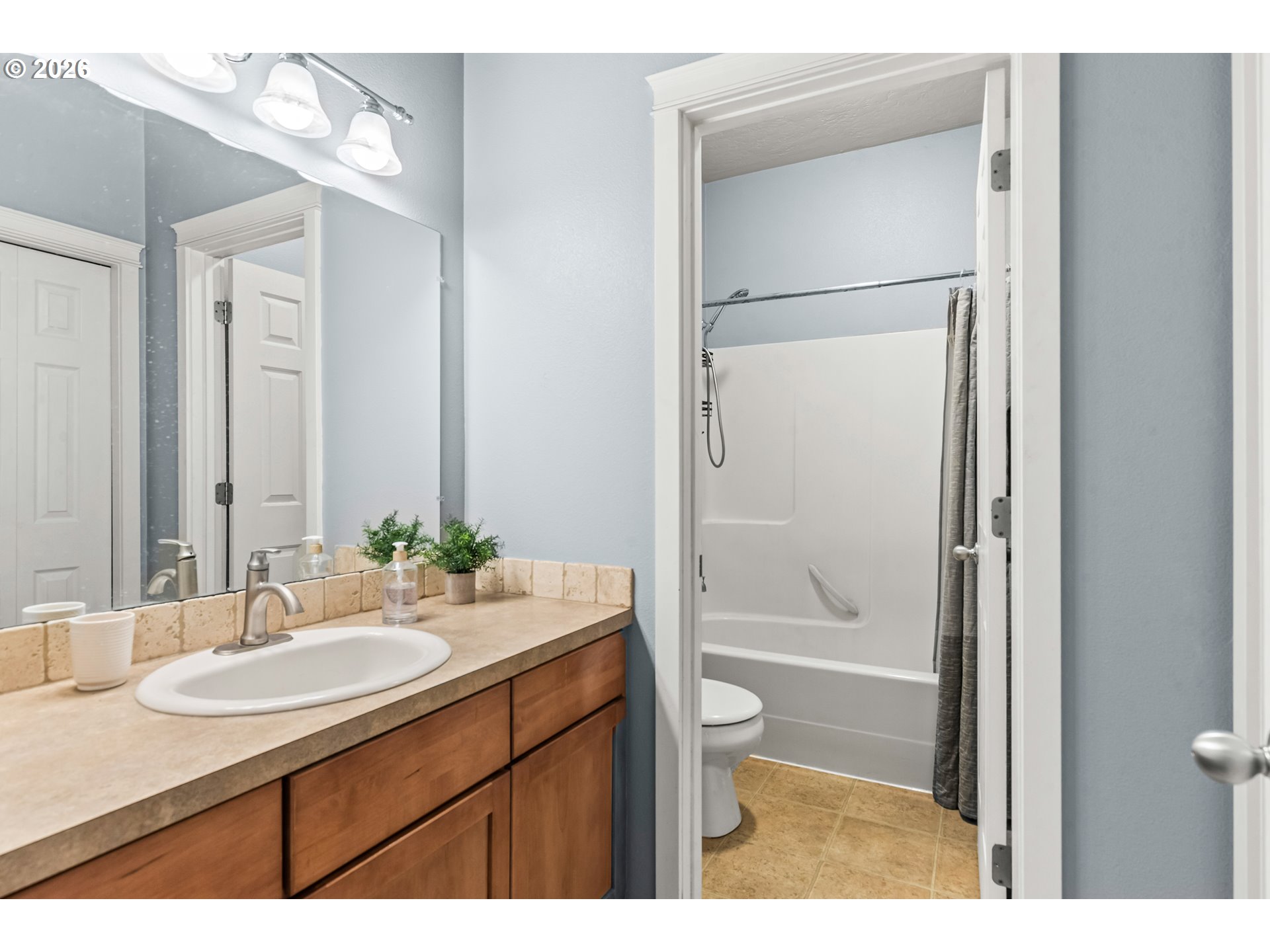 77286 Joyce Way Echo, OR 97826 - Photo 27 of 41 a bathroom with a granite countertop sink mirror toilet and bathtub