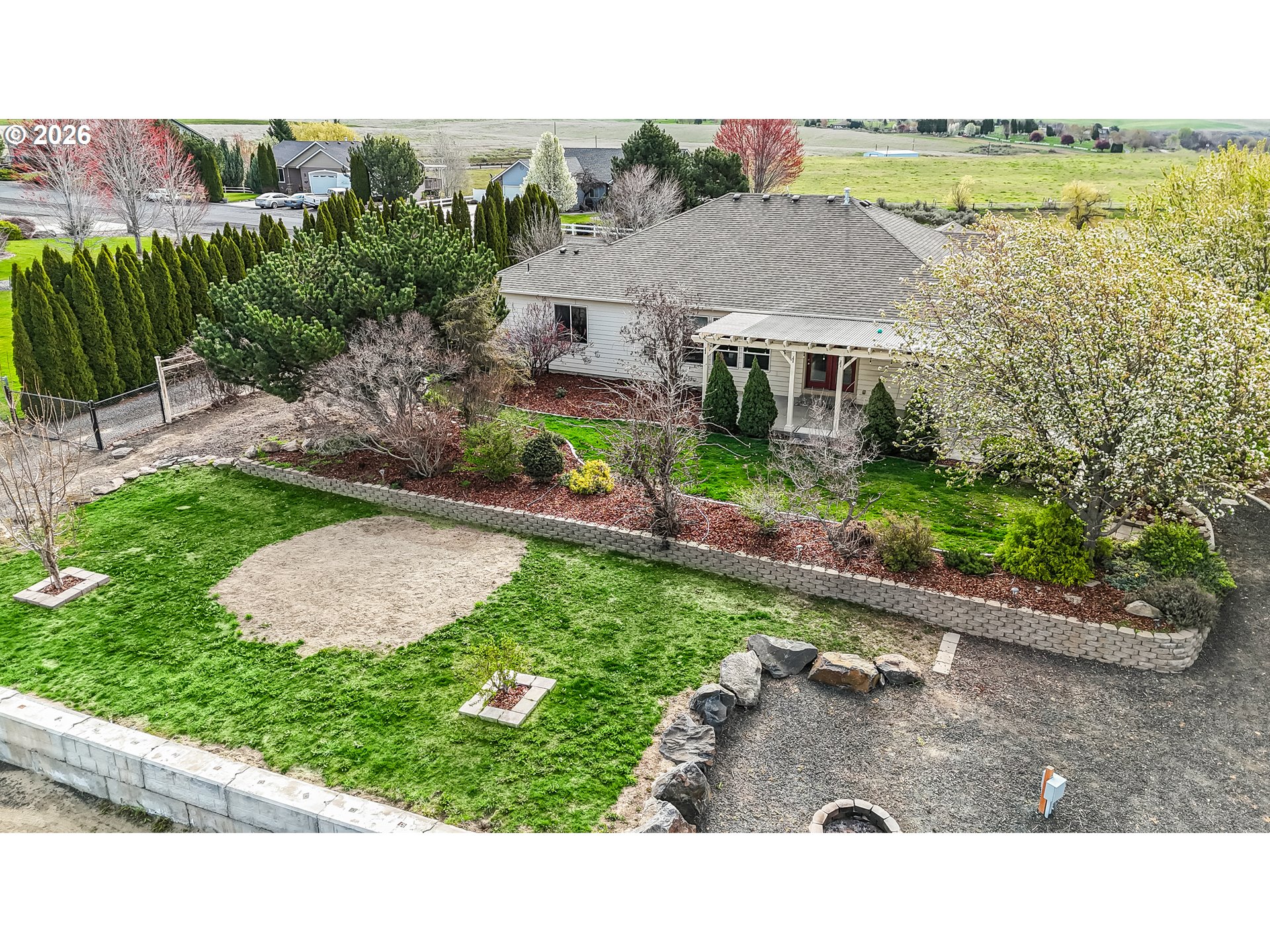 77286 Joyce Way Echo, OR 97826 - Photo 32 of 41 a view of a house with a yard and sitting area