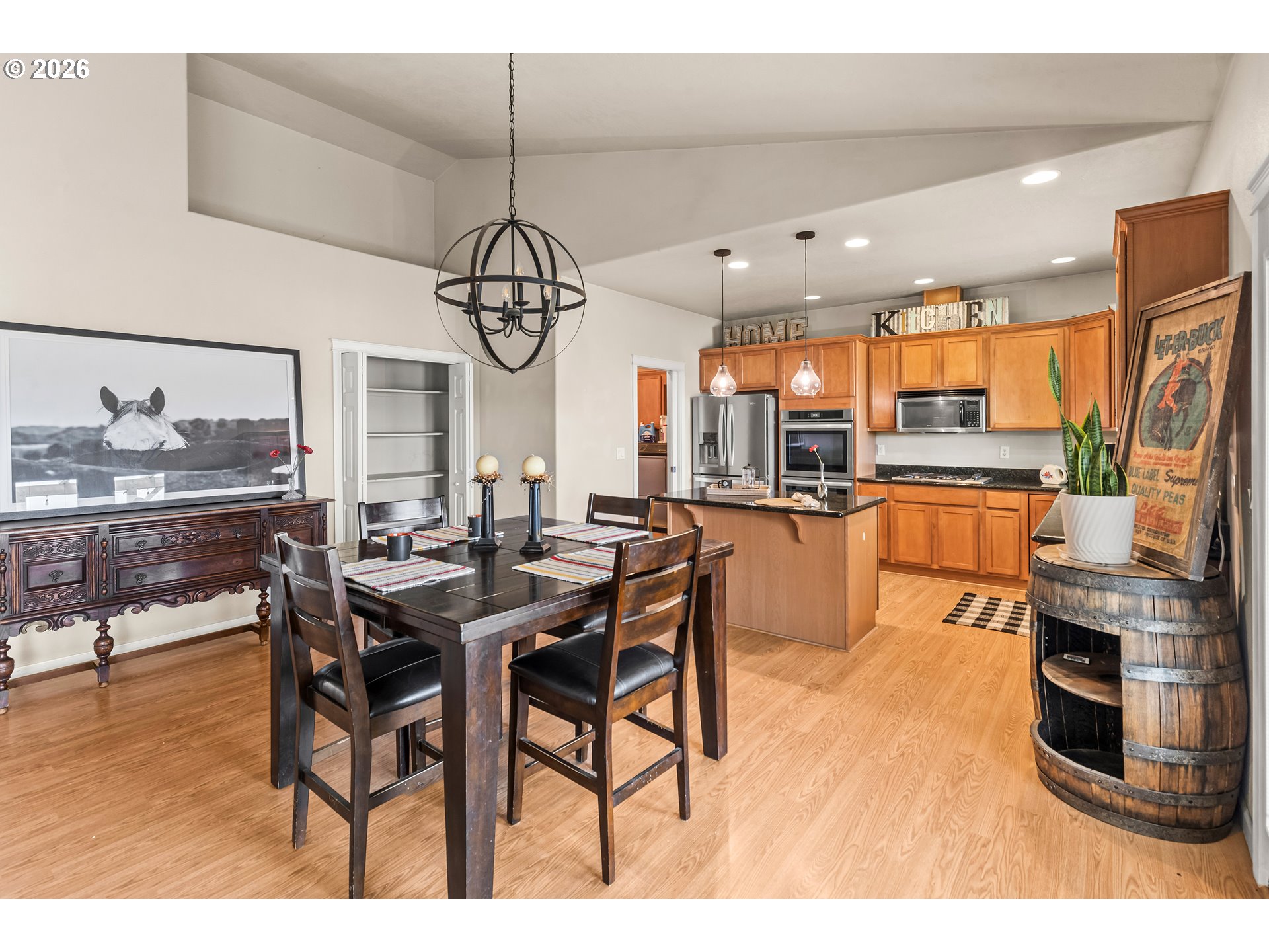 77286 Joyce Way Echo, OR 97826 - Photo 10 of 41 a kitchen with stainless steel appliances kitchen island granite countertop a table chairs sink and cabinets