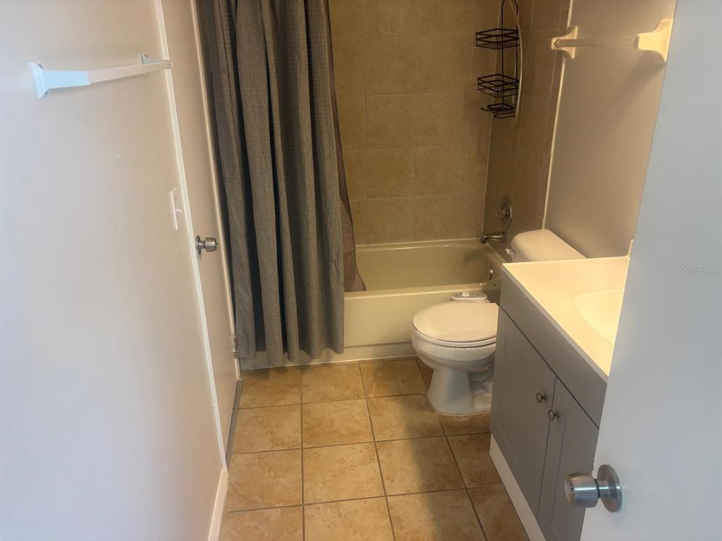 3216 Hempstead Avenue Kissimmee, FL 34741 - Photo 7 of 13 a bathroom with a toilet and a shower