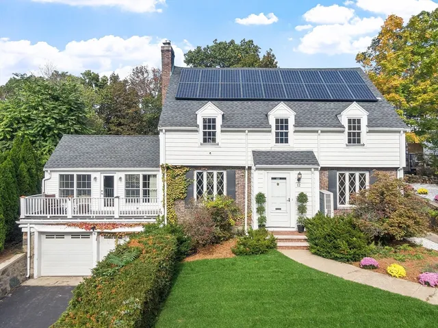 a aerial view of a house with a yard