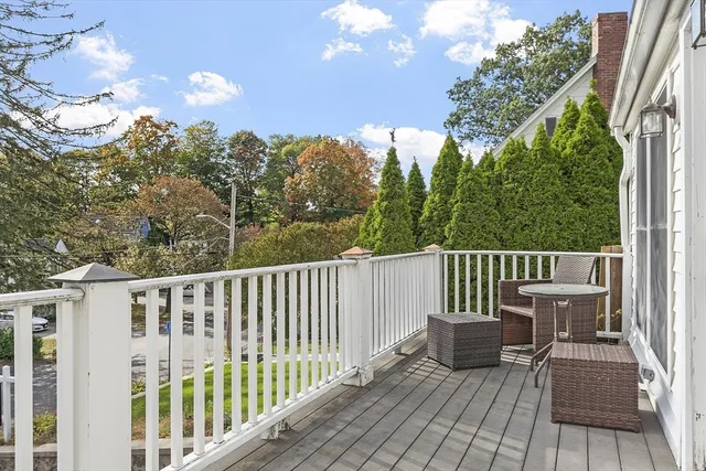 a kitchen with a sink a counter top space stainless steel appliances a window and cabinets