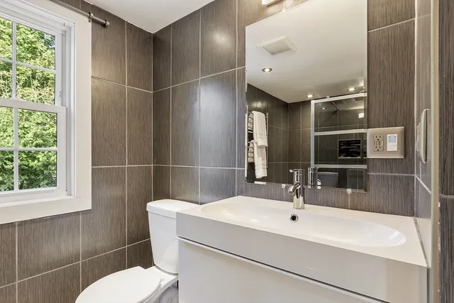 a bathroom with a glass shower door