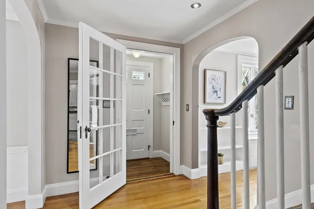a view of entryway with wooden floor and stairs
