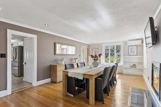 a white painted room with a glass door and shower