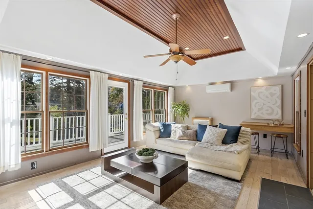 a living room with couches and a fireplace