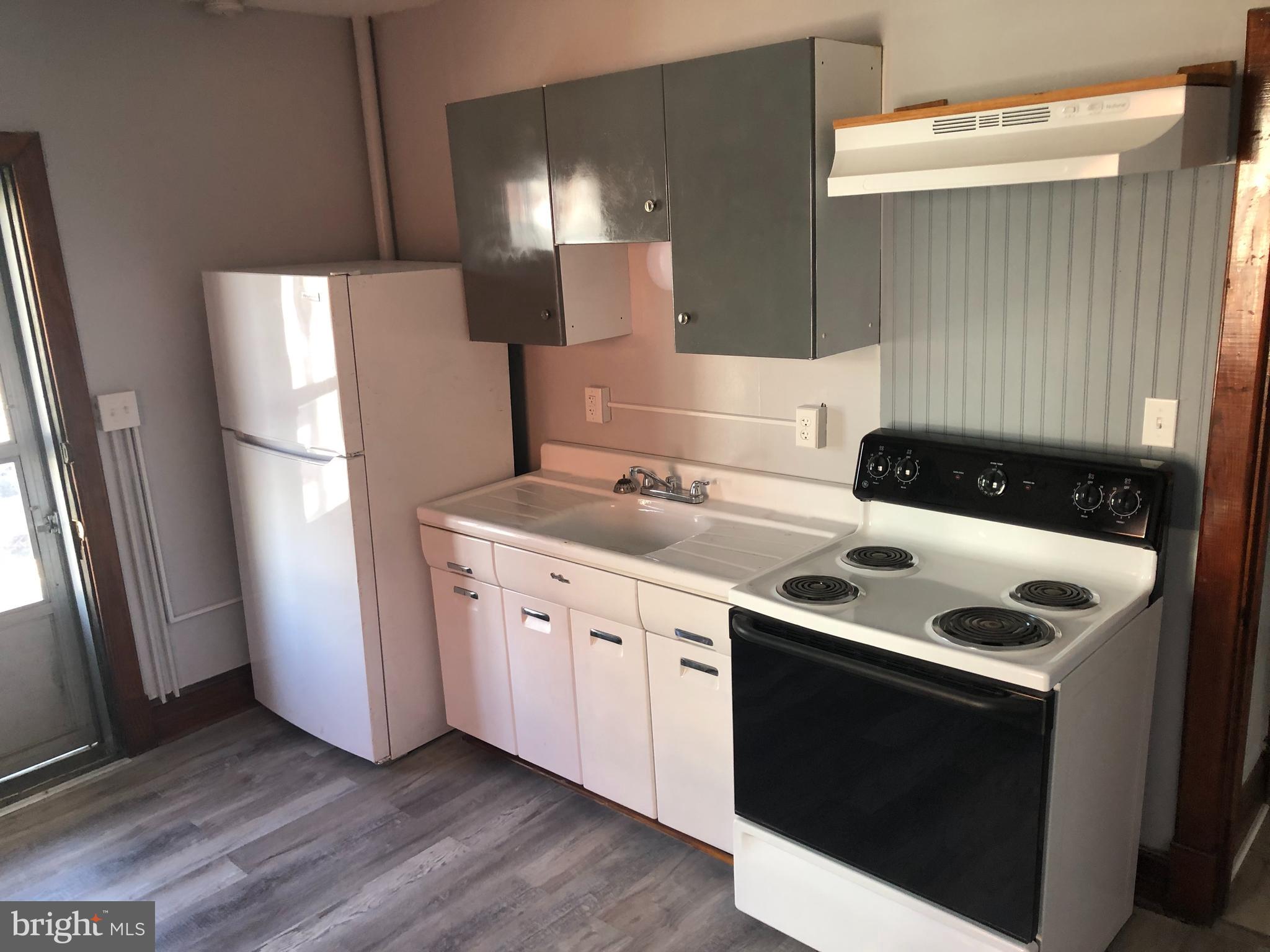 607 Guilford Street, Unit 2 Lebanon, PA 17046 - Photo 2 of 9 a kitchen with a refrigerator sink and stove