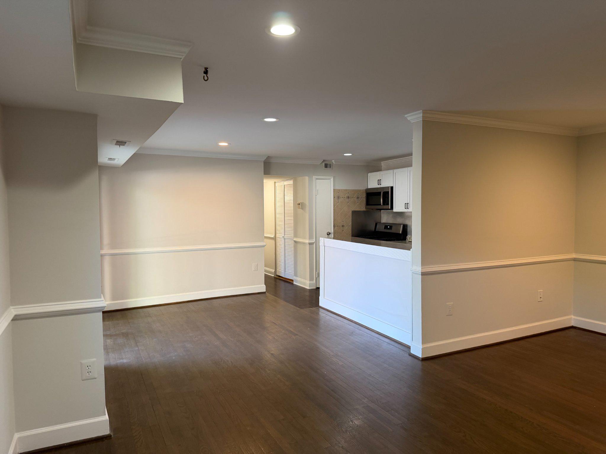 3732 Bel Pre Road, Unit 2 Silver Spring, MD 20906 - Photo 11 of 21 a view of a kitchen with a fridge and wooden floor