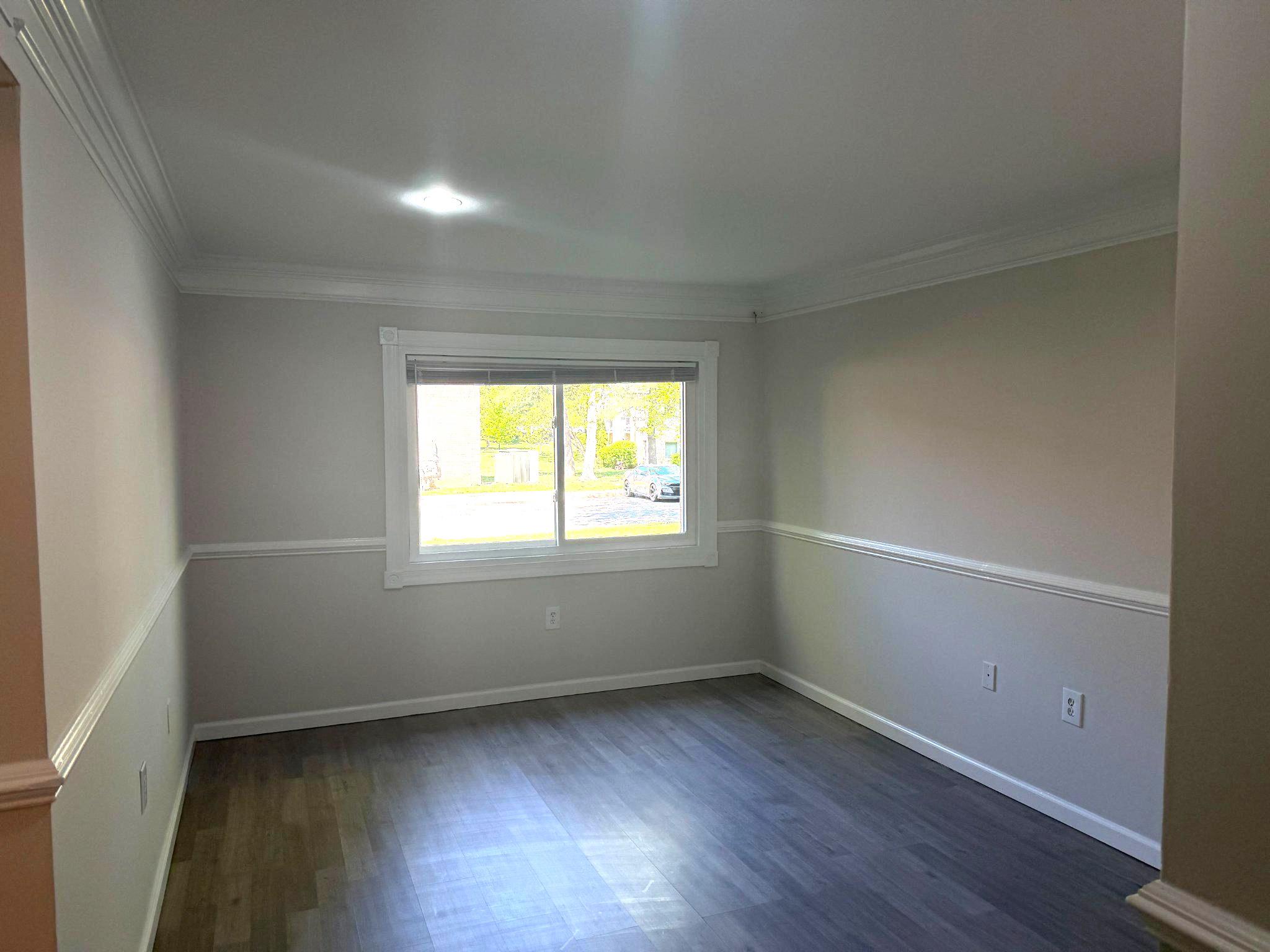 3732 Bel Pre Road, Unit 2 Silver Spring, MD 20906 - Photo 14 of 21 an empty room with wooden floor and windows