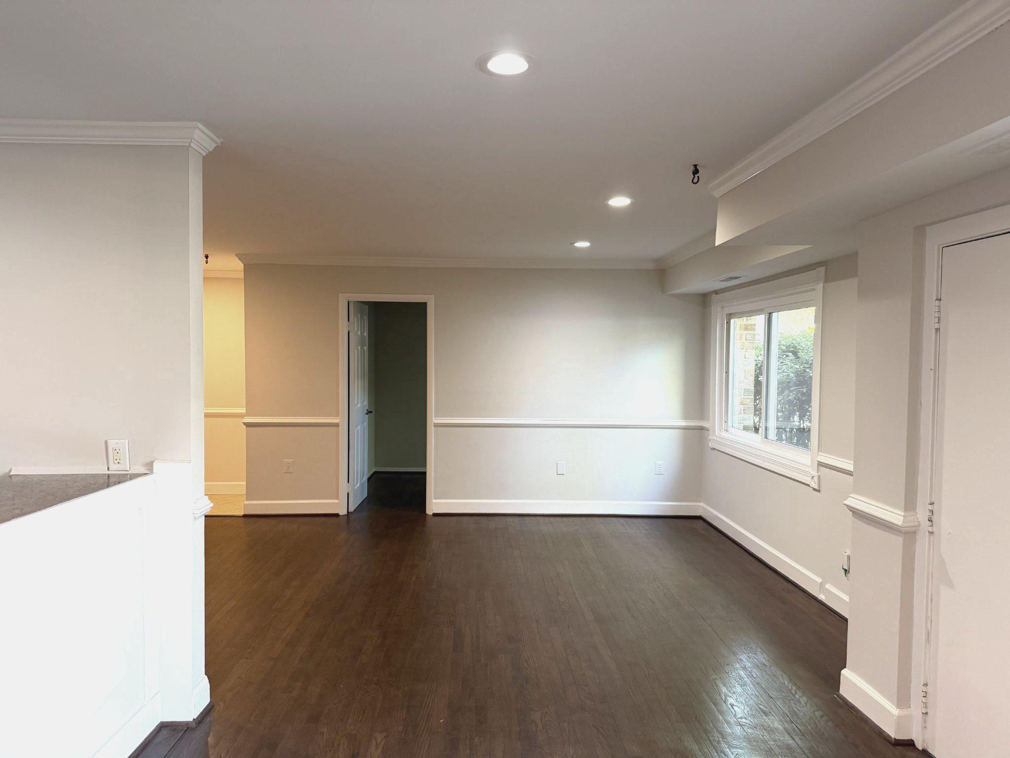 3732 Bel Pre Road, Unit 2 Silver Spring, MD 20906 - Photo 3 of 21 an empty room with wooden floor and white walls