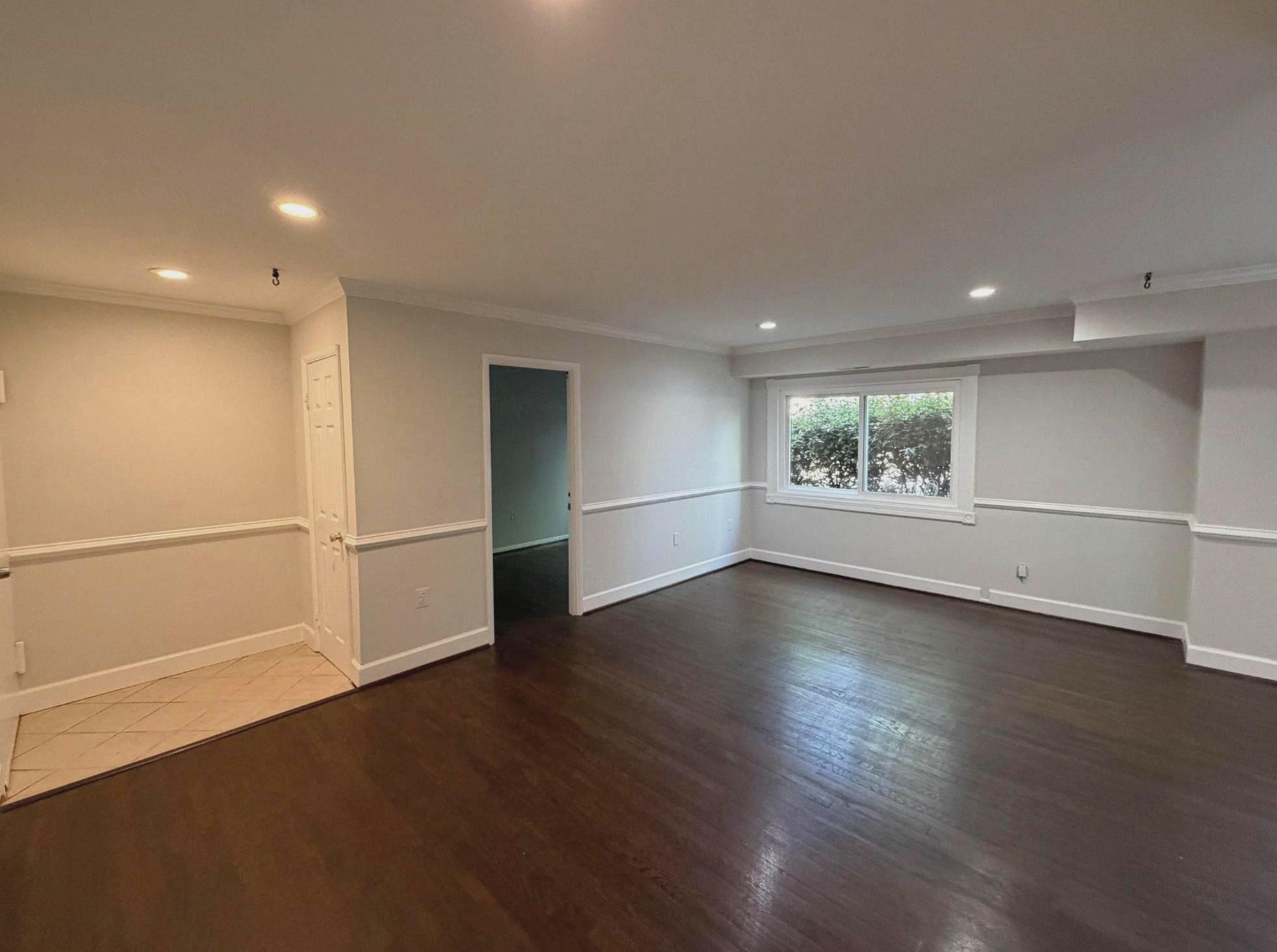 3732 Bel Pre Road, Unit 2 Silver Spring, MD 20906 - Photo 4 of 21 an empty room with wooden floor and white walls