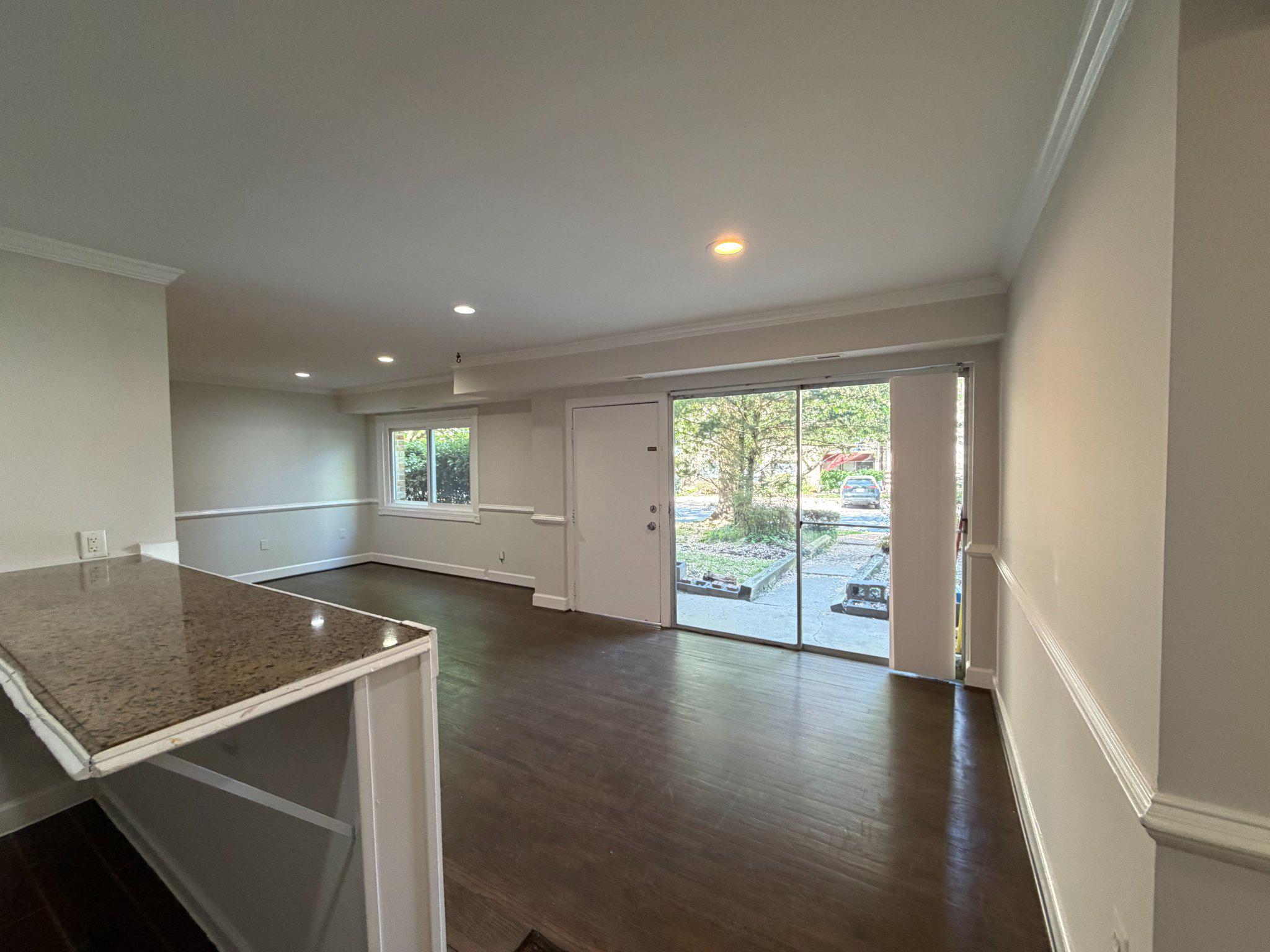 3732 Bel Pre Road, Unit 2 Silver Spring, MD 20906 - Photo 9 of 21 an empty room with wooden floor and windows