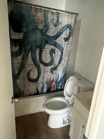 a bathroom with a toilet and a sink