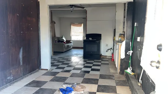 a kitchen with a sink and a refrigerator