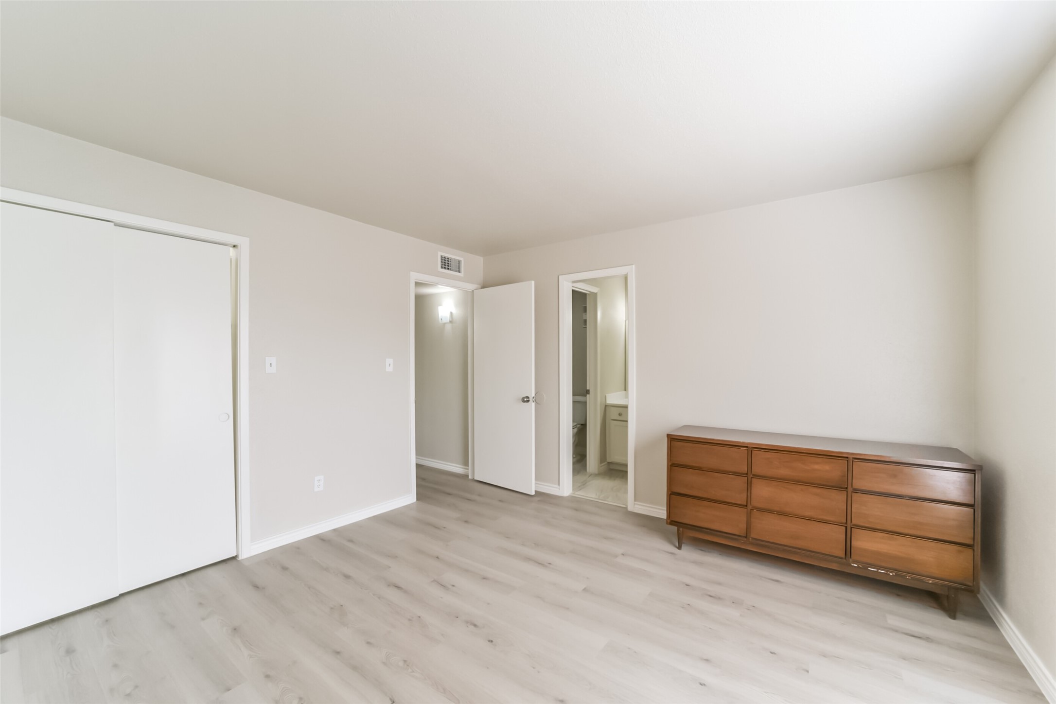 6202 Skyline Drive, Unit 44 Houston, TX 77057 - Photo 17 of 29 a view of a room with wooden floor and cabinet