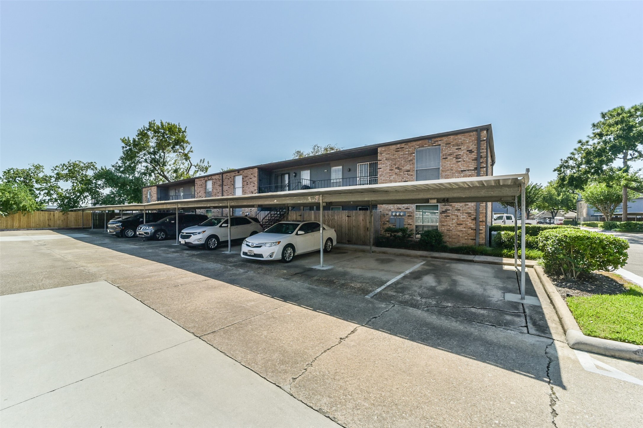 6202 Skyline Drive, Unit 44 Houston, TX 77057 - Photo 25 of 29 a car parked on the side of the road