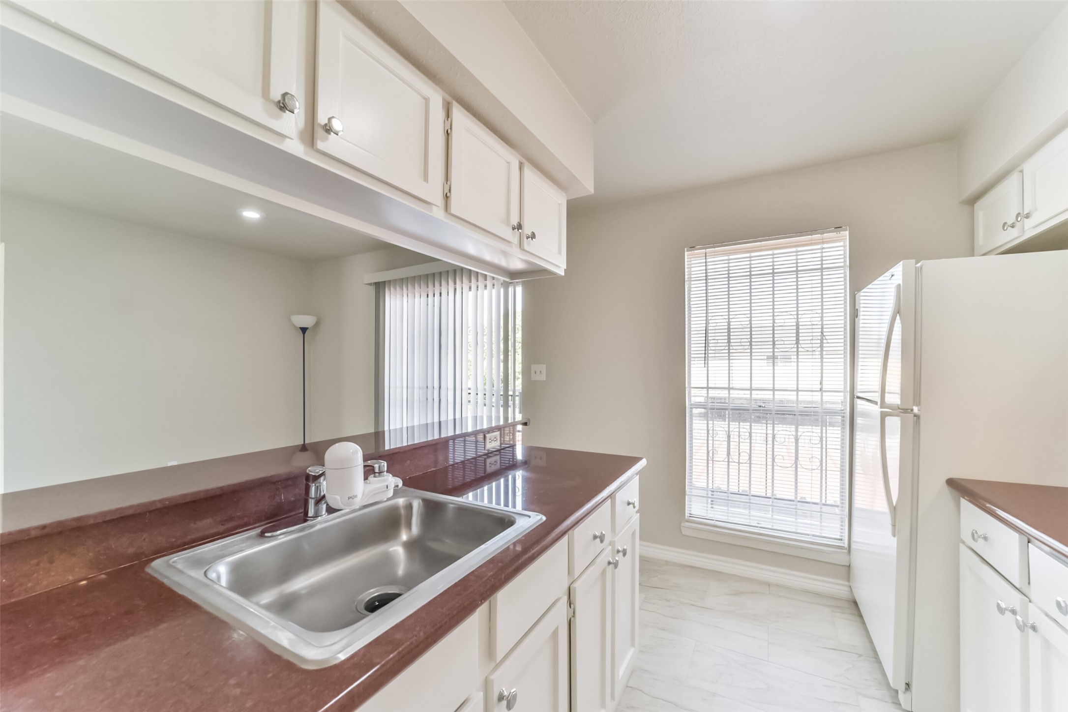 6202 Skyline Drive, Unit 44 Houston, TX 77057 - Photo 10 of 29 a kitchen with stainless steel appliances granite countertop a sink and a white cabinets