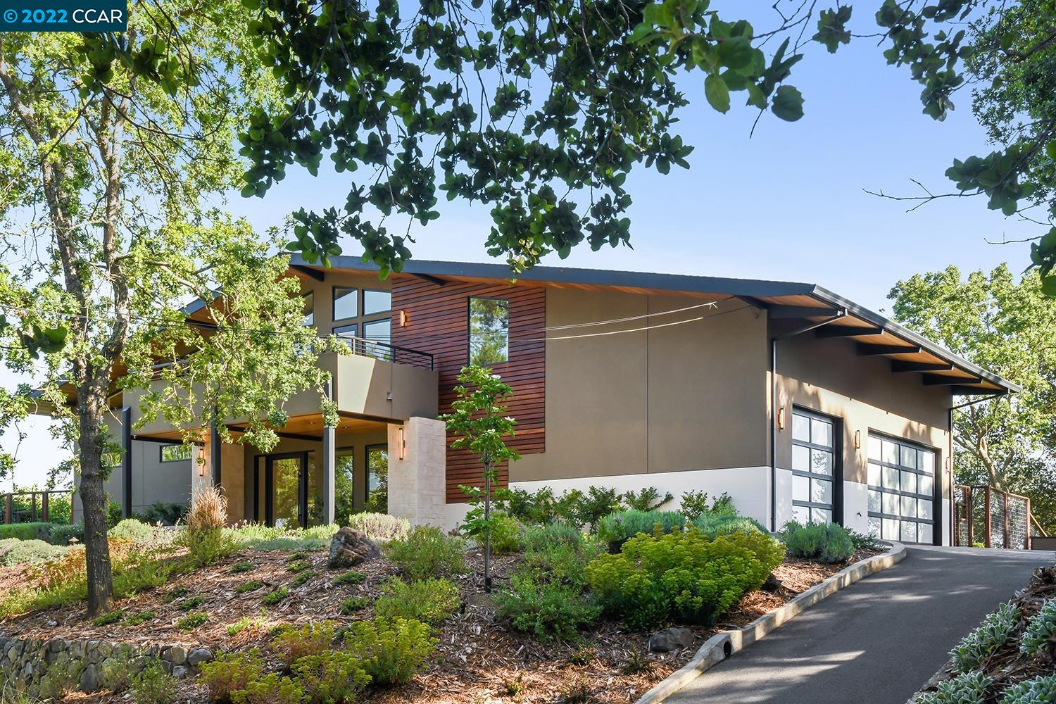 front view of a house with a tree