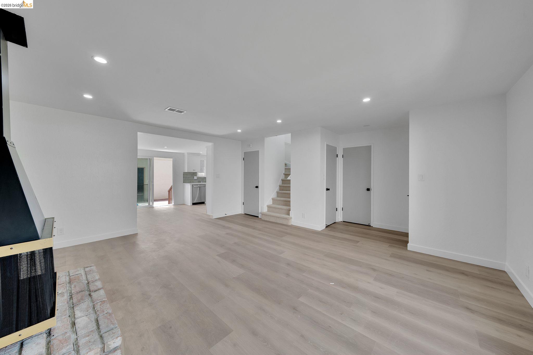 1808 Wildbrook Court, Unit D Concord, CA 94521 - Photo 5 of 47 a view of empty room with wooden floor