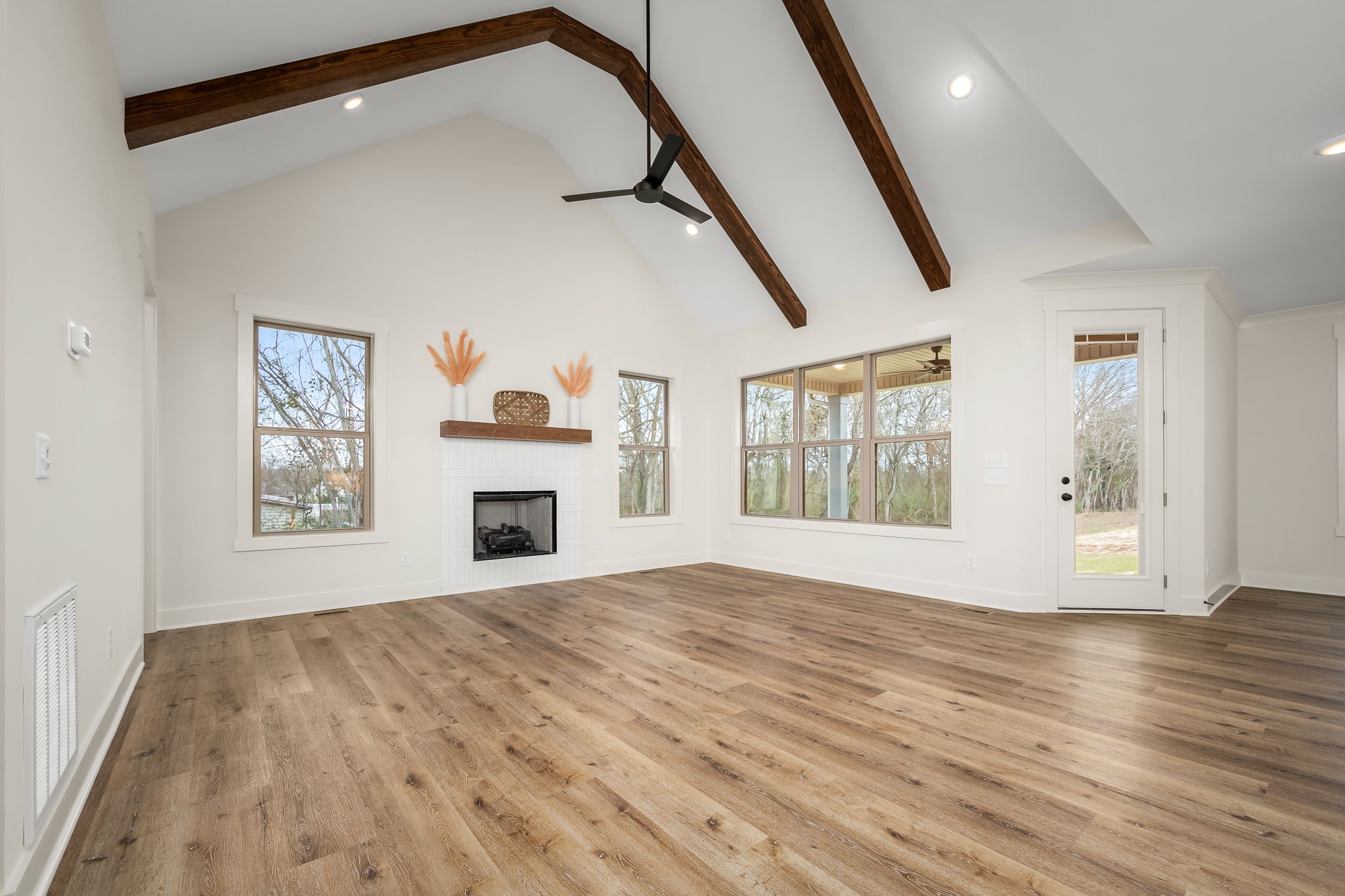7314 West Gum Road Murfreesboro, TN 37127 - Photo 10 of 49 a view of an empty room with wooden floor and a window