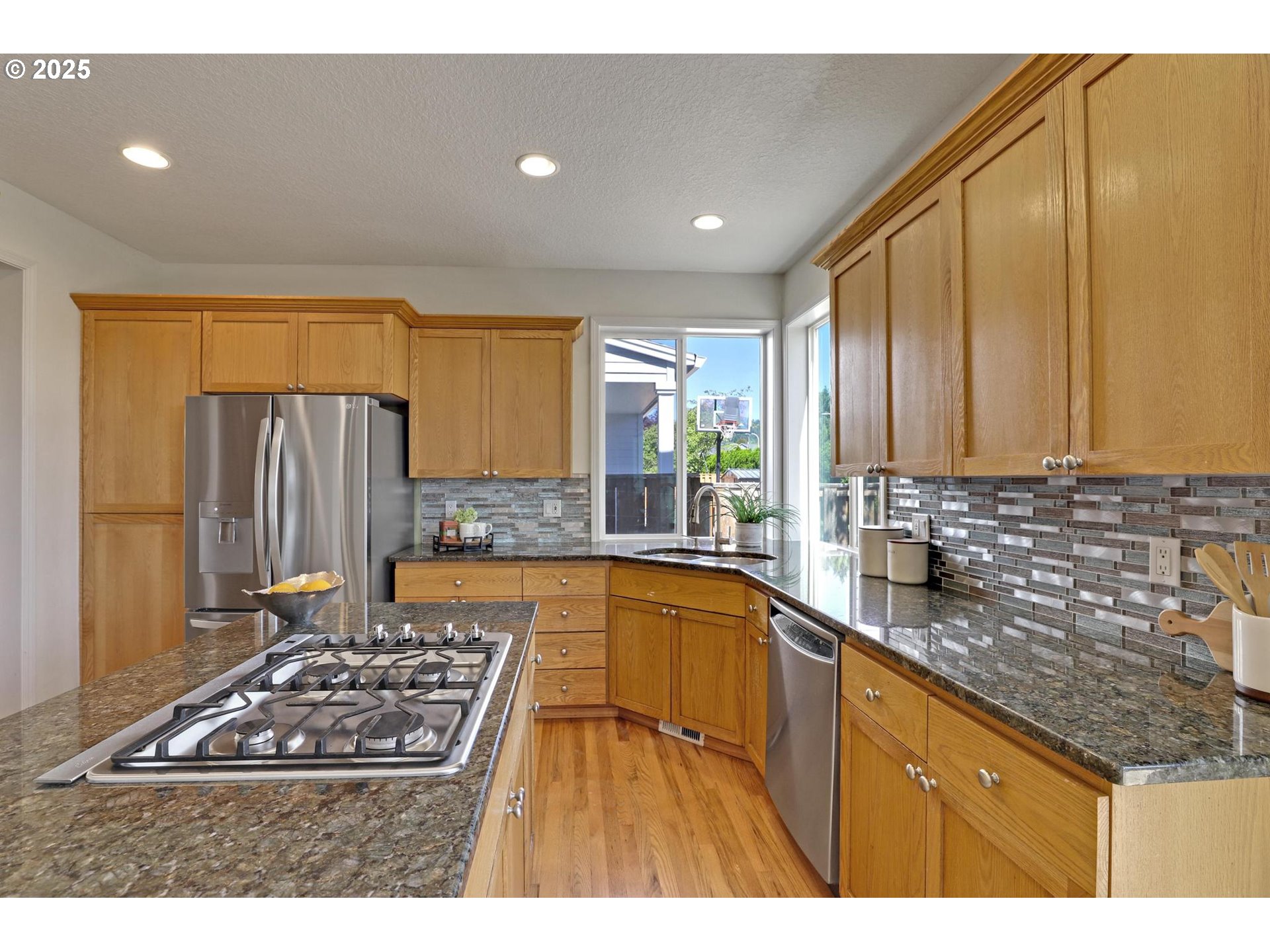 3816 Northwest Tustin Ranch Drive Portland, OR 97229 - Photo 10 of 28 a kitchen with stainless steel appliances granite countertop a sink stove and refrigerator