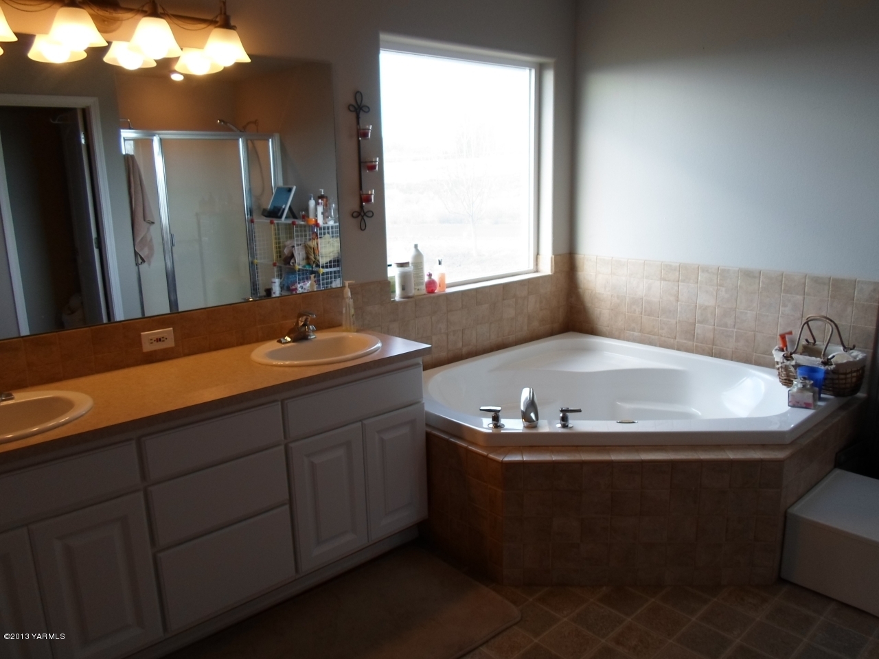 9721 Mieras Road Yakima, WA 98901 - Photo 14 of 34 a bathroom with a granite countertop sink and a mirror