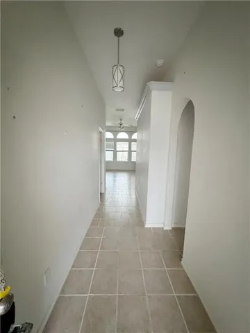 a view of a hallway with windows