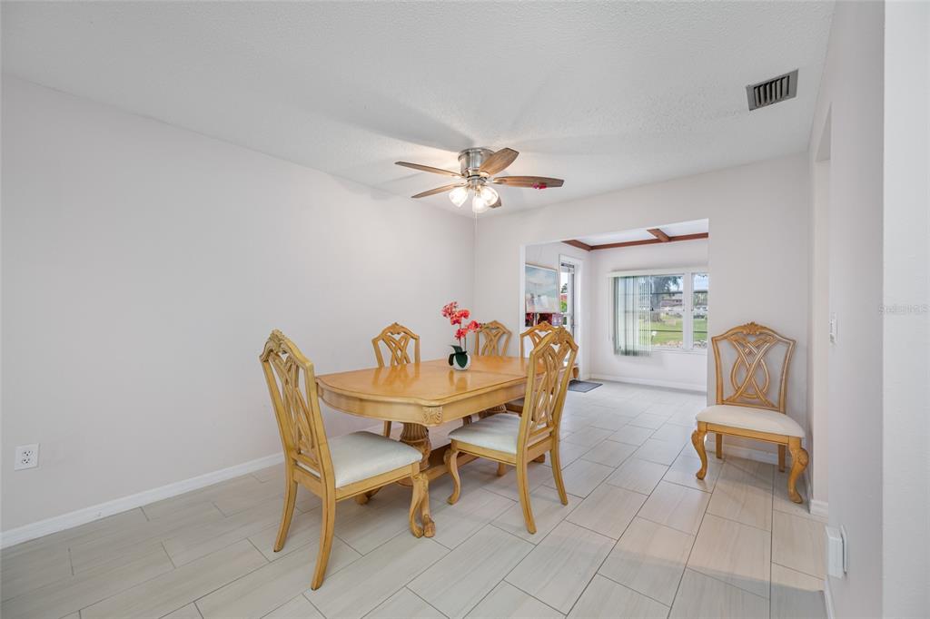 12200 Vonn Road, Unit 8A Largo, FL 33774 - Photo 11 of 41 a dining room with furniture and window