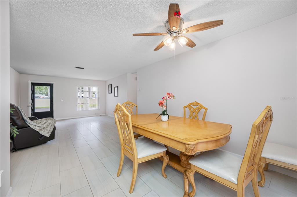 12200 Vonn Road, Unit 8A Largo, FL 33774 - Photo 13 of 41 a view of a dining room with furniture and wooden floor