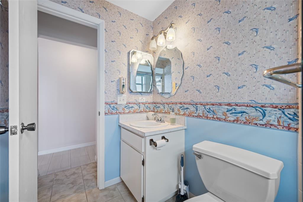 12200 Vonn Road, Unit 8A Largo, FL 33774 - Photo 14 of 41 a bathroom with a sink toilet and vanity