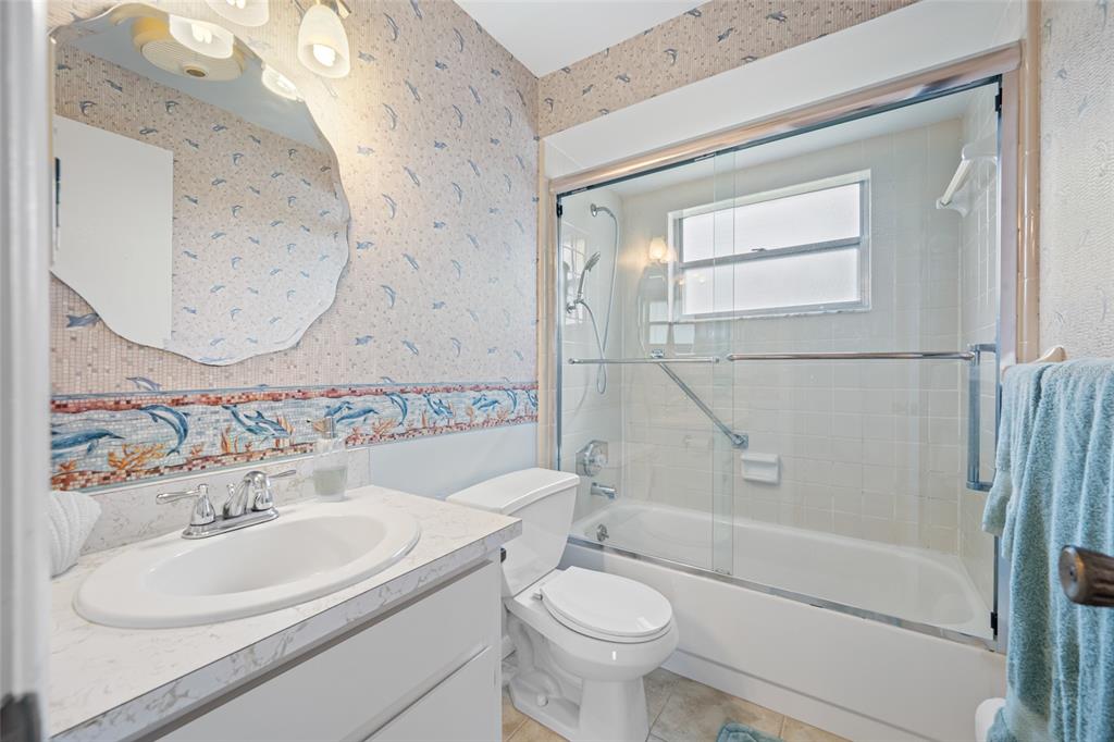 12200 Vonn Road, Unit 8A Largo, FL 33774 - Photo 15 of 41 a bathroom with a sink toilet and shower