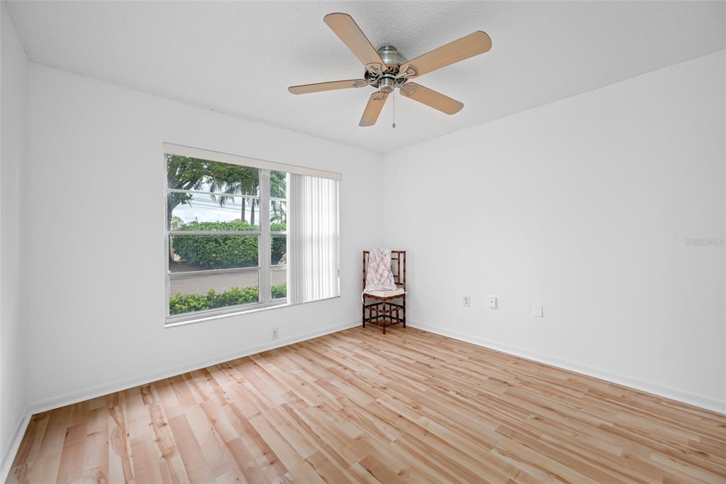 12200 Vonn Road, Unit 8A Largo, FL 33774 - Photo 25 of 41 wooden floor in an empty room with a window