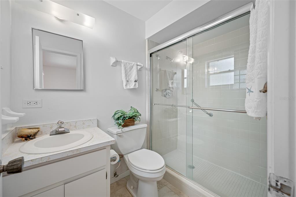 12200 Vonn Road, Unit 8A Largo, FL 33774 - Photo 27 of 41 a bathroom with a sink toilet and shower