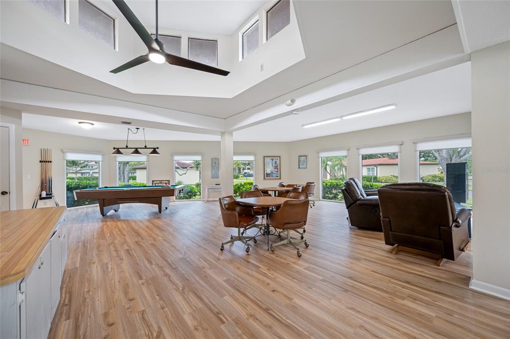 12200 Vonn Road, Unit 8A Largo, FL 33774 - Photo 32 of 41 a living room with furniture and a wooden floor
