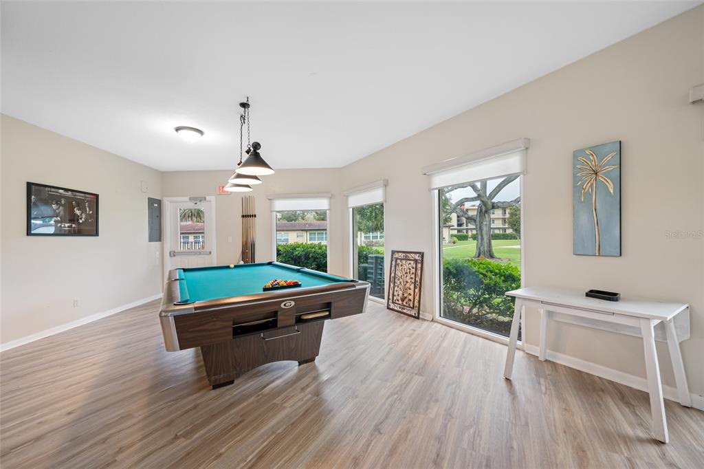 12200 Vonn Road, Unit 8A Largo, FL 33774 - Photo 33 of 41 a room with pool table and windows