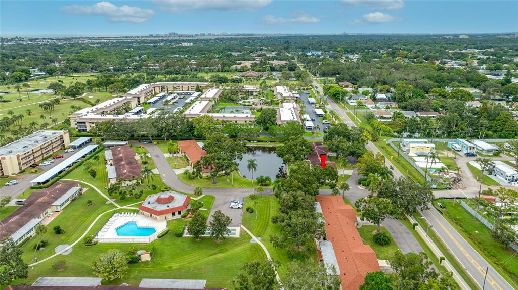12200 Vonn Road, Unit 8A Largo, FL 33774 - Photo 39 of 41 an aerial view of residential houses with outdoor space and trees
