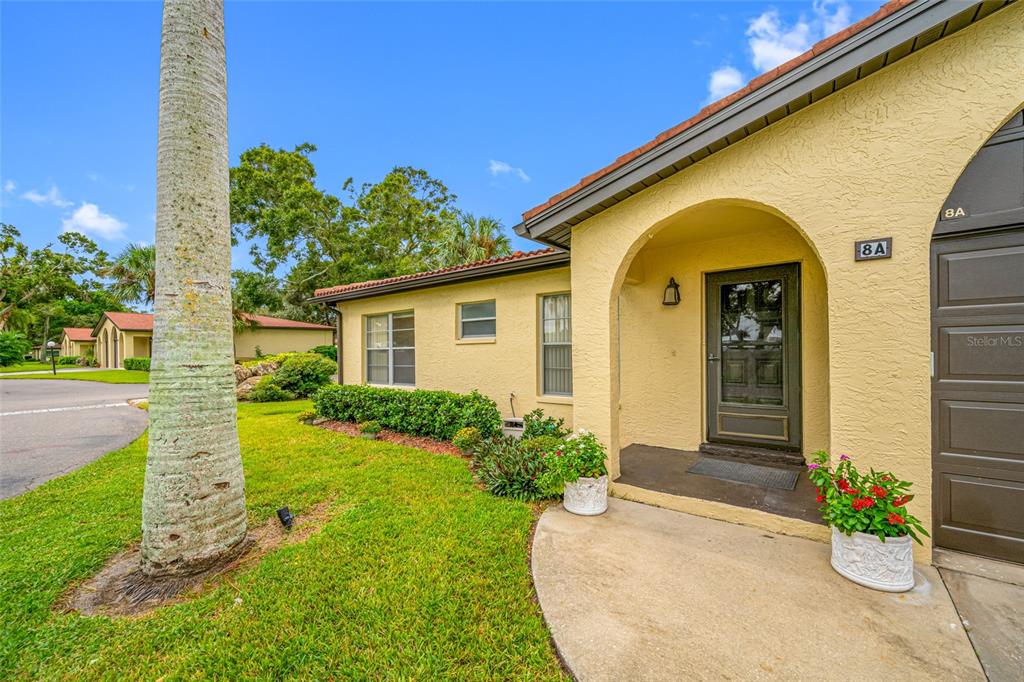 12200 Vonn Road, Unit 8A Largo, FL 33774 - Photo 4 of 41 a front view of a house with garden