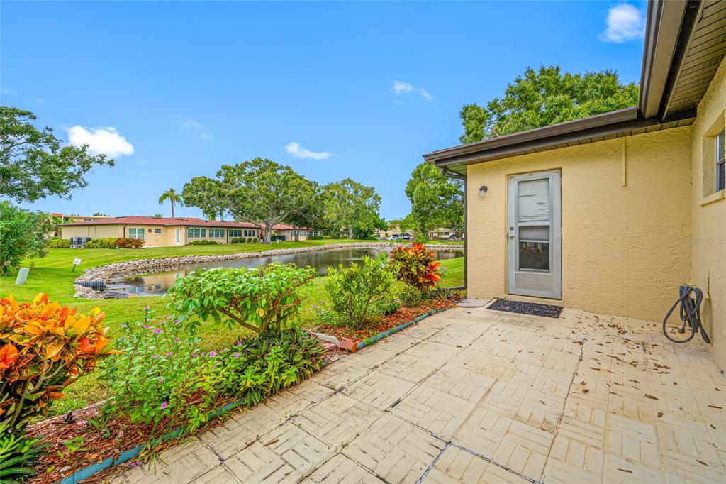 12200 Vonn Road, Unit 8A Largo, FL 33774 - Photo 7 of 41 a front view of a house with a yard