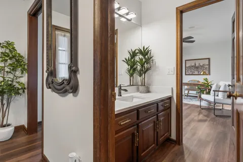 a en suite bathroom with a sink and a mirror