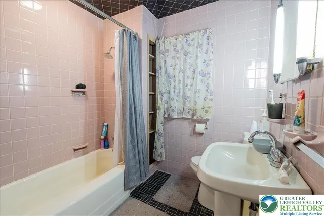 a bathroom with a sink and a bathtub
