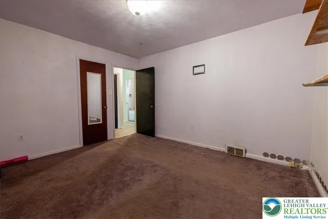 an empty room with a empty space and window