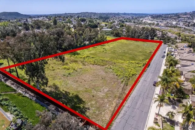 an aerial view of a city with lots of residential buildings