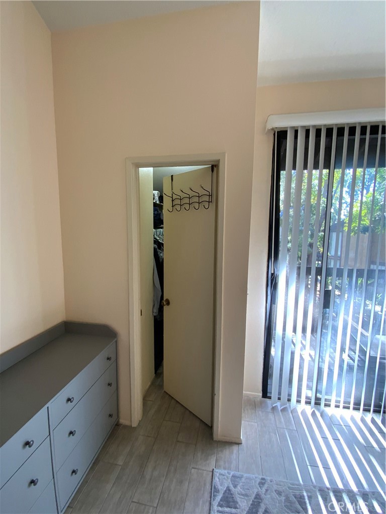 4140 Workman Mill Road, Unit 172 Whittier, CA 90601 - Photo 13 of 21 a view of an empty room with wooden floor and a window