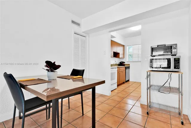 a view of a dining room with furniture and a table