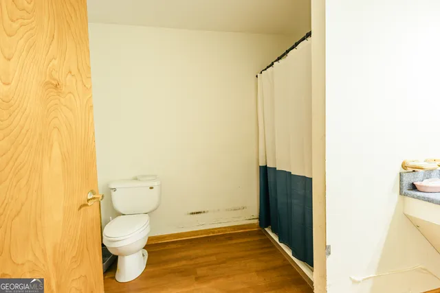 a bedroom with a bed and cabinets