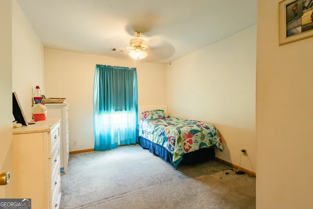 a bedroom with a bed and a cabinets